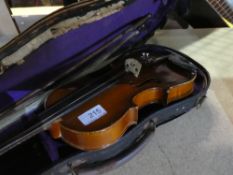 An old violin in case with bow, the back 31cm