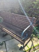 Two garden benches having metal supports
