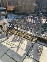 An old cast iron bench having wooden slatted seat