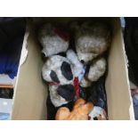 A box of plush penguins and teddy bears