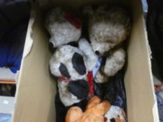 A box of plush penguins and teddy bears