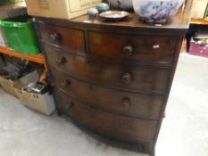 A serpentine fronted 3 drawers over 2 mahogany veneered chest with some damage to corners and missin