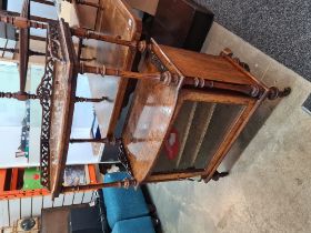 A Victorian Burr walnut music cabinet having glass door with pierced gallery