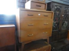 E. Gomme a pair of G-Plan 3 drawer chests and a matching bedside table