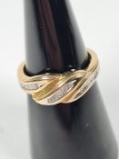 9ct yellow gold dress ring of twisted design, with 3 rows of Channel set tapering diamonds, size L,