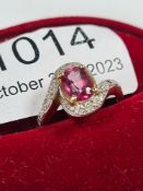9ct yellow gold dress ring set central oval faceted pink gemstone with crossover design mount inset