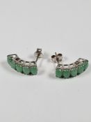 Pair of Sterling silver earrings of curved form, each set 5 oval cabouchon of Jade, marked 925, 2cm,