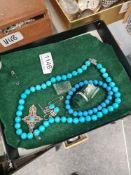 Silver and turquoise jewellery to include earrings, necklace and ring and a similar bracelet