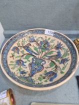 A Persian possibly Iznik pottery bowl, 19th Century, decorated vase of flowers and birds, 24.5cms