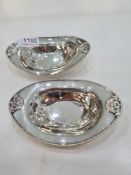A pair of silver Edwardian oval bon bon dishes, having embossed details and beaded border. Hallmarke