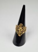 22ct yellow gold decorative panel ring, of Indian design, marked 916, approx 3.63g