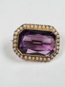 Antique yellow gold brooch with large scissor cut amethyst chip to side, in tapered rectangular fram