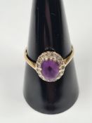 9ct yellow gold dress ring with oval (worn) amethyst surrounded diamond chips, marked 375, size R, a
