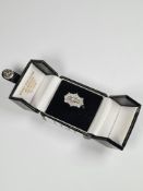 Beautiful 18ct white gold diamond cluster ring with three baguette cut diamonds surrounded 12 round