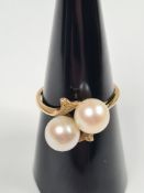 14K yellow gold dress ring set with two pearls in cross over design, marked 14K, size N, approx 2.88