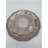 A Ceylonese tray, Sri Lanka, of circular form, having repoussed, pretty design. Highly decorative bo