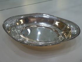 A German silver oval fruit bowl by Gebruder Kuhn, Schwabisch, Gmund, from 1860. Having beaded rim. 3