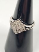 Contemporary 9ct white gold diamond cluster ring with diamond shaped panel inset round cut and bague