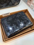 Louis Vuitton: A Louis Vuitton black patent leather zippy purse, 12.5cm x 9.5cm, really good conditi