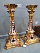 A pair of Royal Crown Derby Imari pattern candlesticks (one A/F), 26.5cms approx