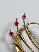 14ct yellow gold decorative brooch with three round cut rubies, 5cm x 2.5cm marked 585, London Impor