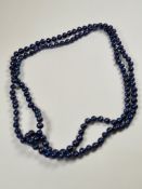 Modern strand of blue coloured pearls, knotted, various shapes