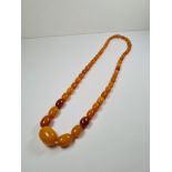 A string of possible Butterscotch amber beads