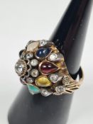 Unmarked yellow gold multi-gem set domed ring, unmarked, size M, approx 6.69g