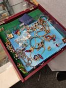 Display case and tray of vintage and modern costume jewellery including brooches, silver bracelet, e