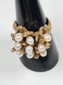 Unusual design 14k yellow gold dress ring, the mount in the form of Coral set 9 oval pearls, marked
