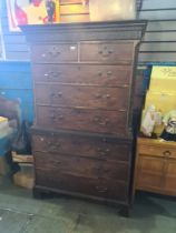 A Georgian mahogany chest on chest with brushing slide on bracket feet