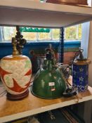 An industrial style green enamelled ceiling light, a cherub figural table lamp and other lighting