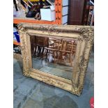 A 19th Century gilt framed wall mirror having Gesso style decoration, 110cm