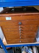 A mid 20th century Mahogany medicine chest having rising lid with 6 drawers under
