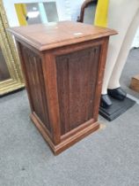 An old oak square storage box with hinged lid, the panels taken from The Houses of Parliament when d