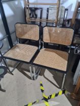 A pair of Cesca style chairs on chrome supports, with cane seat and back