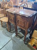 Two similar French carved walnut bedside cupboards with rouge marble tops