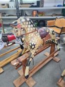 An old wooden rocking horse probably early 20th Century, 142cm