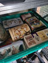 A box of mixed vintage tins and beer steins