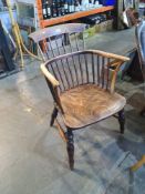 An antique stickback armchair having Elm seat