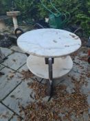 A two - tier metal and marble table, possibly antique AF
