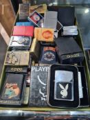 A quantity of Zippo cigarette lighters and others