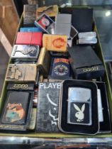 A quantity of Zippo cigarette lighters and others