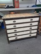 An old painted pine plan chest having 5 long drawers, 124.5cm