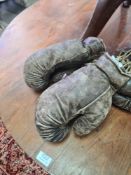Two pairs of old leather boxing gloves