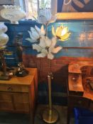 A modern standard lamp having 4 floral glass shades