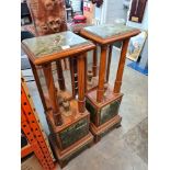 A pair of early 20th century trench empire style figure stand turned pillars with mirror backs, heig