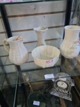 Four items of Belleek pottery to include a floral encrusted vase, with brown back stamp, 16cm