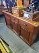 A vintage teak sideboard having 3 drawers with cupboards below, 166cm