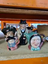 A Royal Doulton Winston Churchill Toby jug, other Doulton character jugs and a Beswick teapot